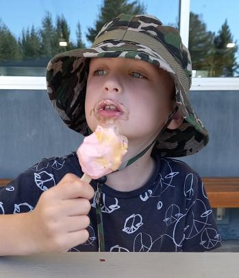 Jordan Richardson (7) enjoys an ice-cream at the Centennial Pool, Alexandra, on New Year’s Day....
