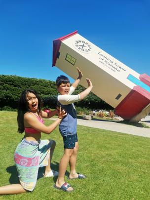 Maya Satake (14) and brother Marcus (8) co-operate in some heavy lifting at Puzzling World,...
