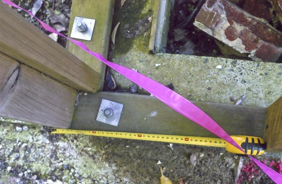A pink ribbon indicates where the legal boundary runs through the corner of Chris Gable's home....