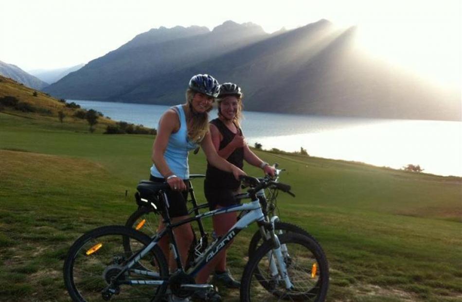 Phillipa Bennett (left) and Olivia Caldwell enjoy an evening ride on the Jack's Point track  at...