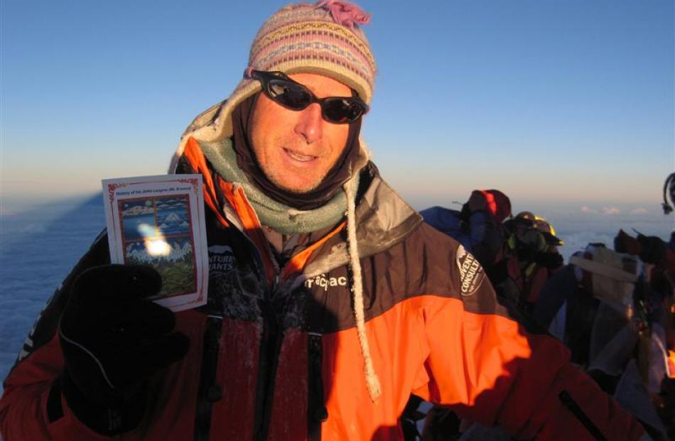 Mike Roberts on the summit of Everest in 2007. Photo supplied.