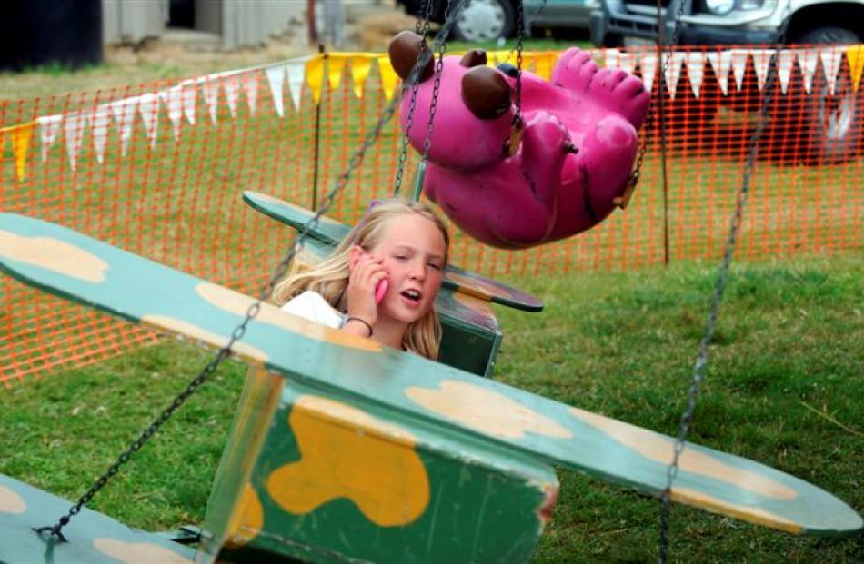 Terese Best (8), of Cromwell, rides the carousel.