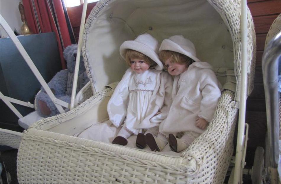 A c1930 cane twin pram.