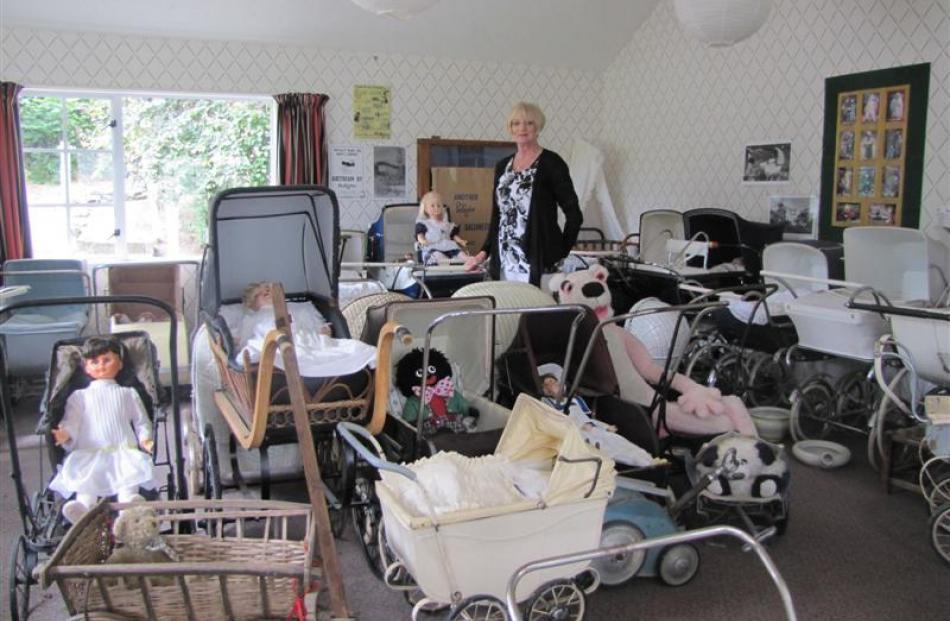 Shingle Creek pram collector Lesley McGregor with some of her 60 prams which date back to the...