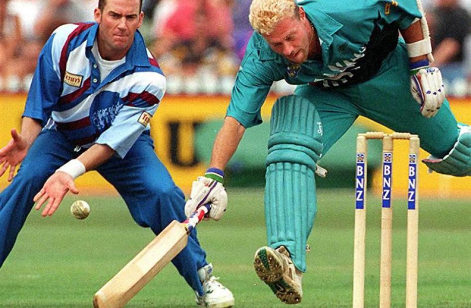 Heath Davis narrowly makes his ground during a one-day match against England in 1997.
