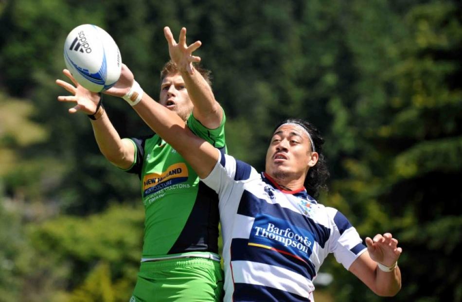 Auckland's Ben Lam (L) makes an intercept against South Canterbury.