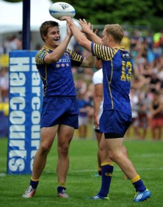Otago players celebrate a try against Wellington.