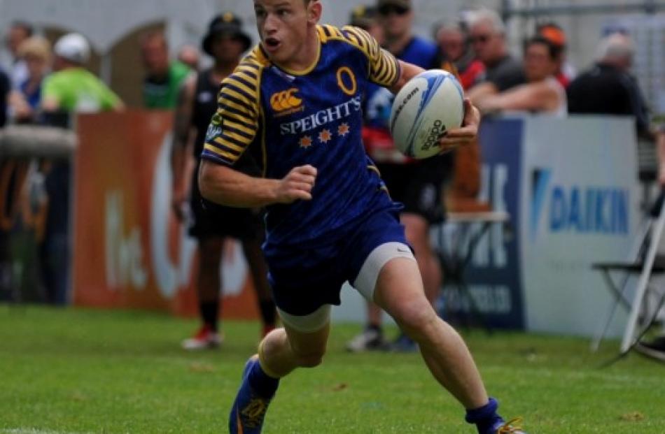 Otago's Brad Weber searches for the line against Wellington.