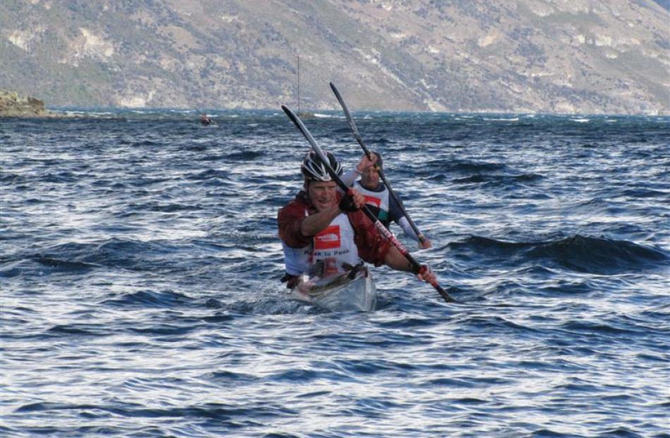 Paddling in Queenstown Bay in rough conditions in the Peak2Peak multisport race in 2011. Photo by...