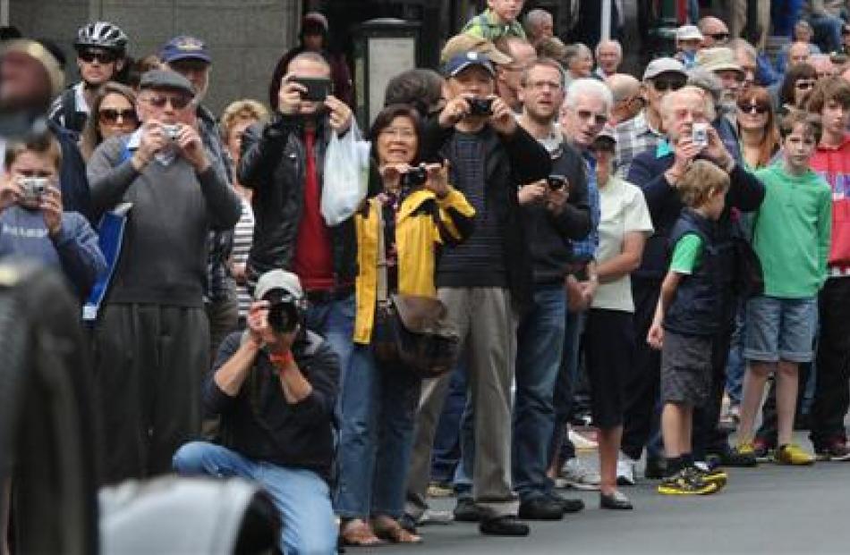 The crowd watches the procession.