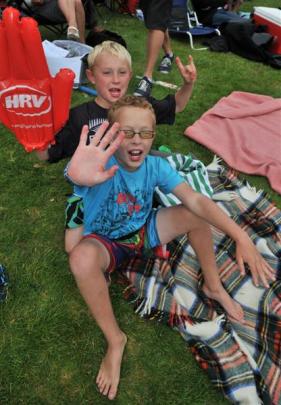 Dunedin brothers Rhys (10), front, and Tyler (7) Curtis enjoy the game.