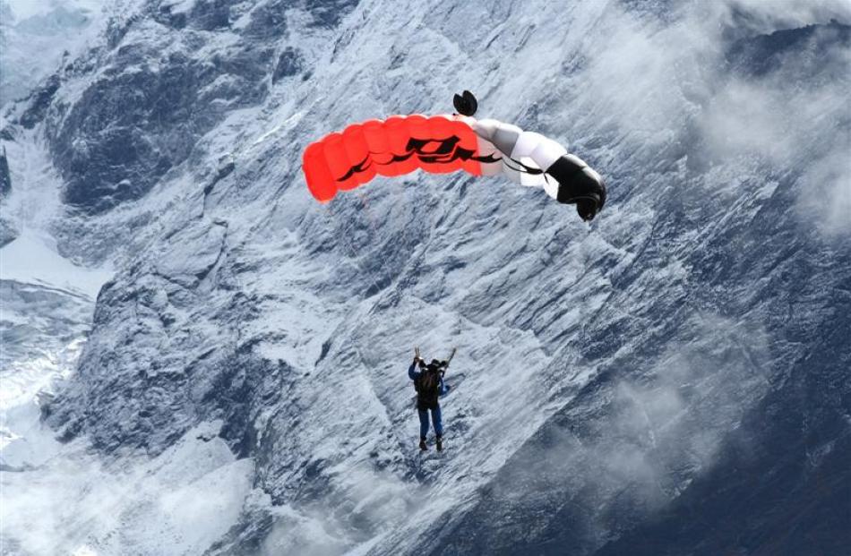 Wendy Smith parachuting in the mountains. She says the first time she jumped over Mt Everest the...