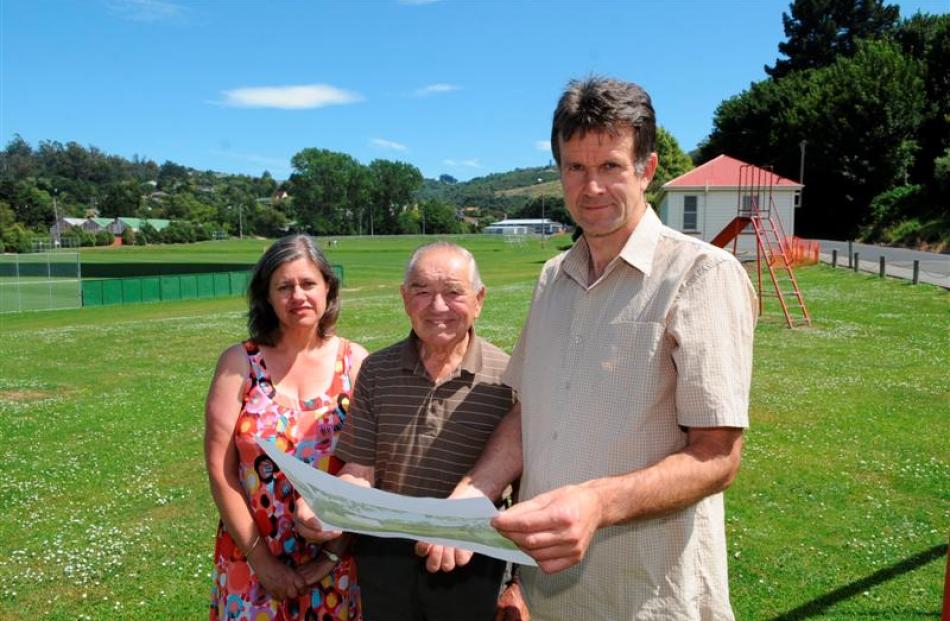 Kerry Goodhew (right), wife Elizabeth and neighbour Ron Chapman examine plans for new buildings...