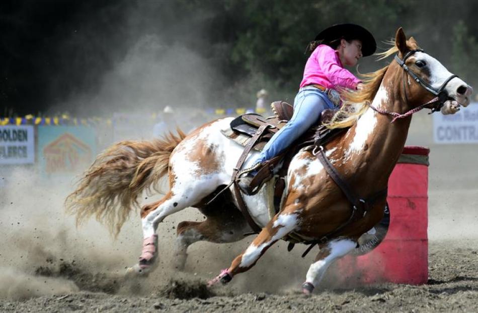 Courtney Haitana, of Hastings, competes in the open barrel race during the Waikouaiti Rodeo...