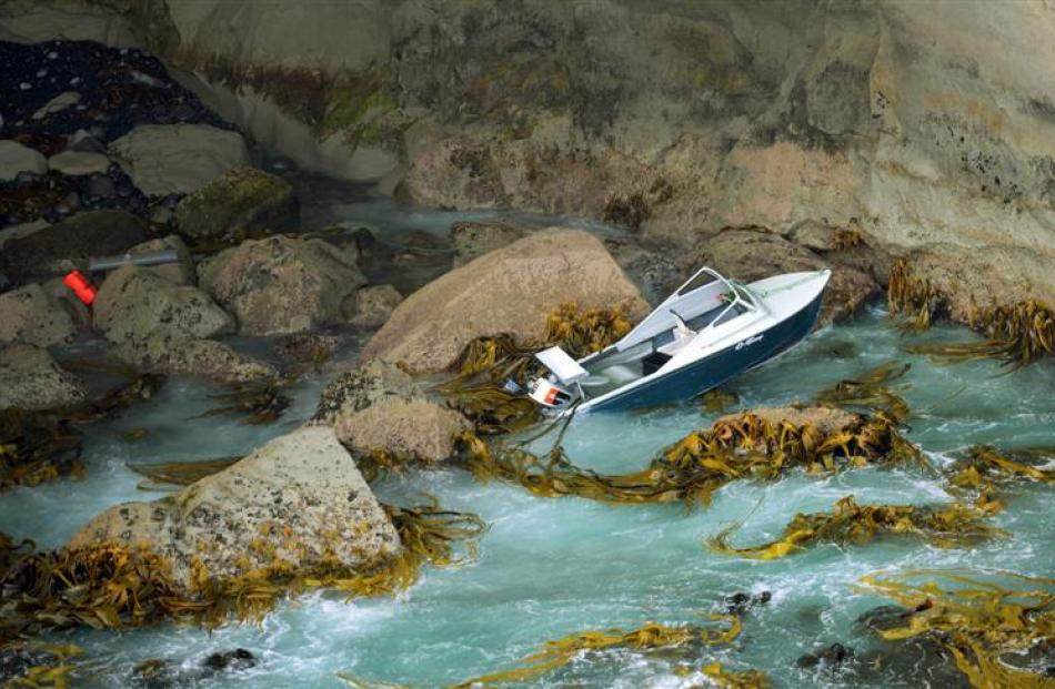 The boat, which was washed into a cave between Tunnel Beach and Highgrove. Photo by Stephen...