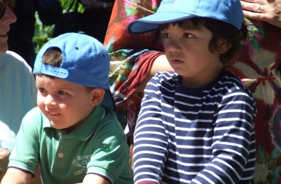 Tyler Hanrahan (3), left, and Tama Kopa (3), both of Queenstown, are mesmerised by the action in...