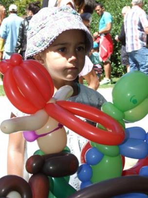 Waiting for her balloon animal  is India Barnett (3), of Queenstown.