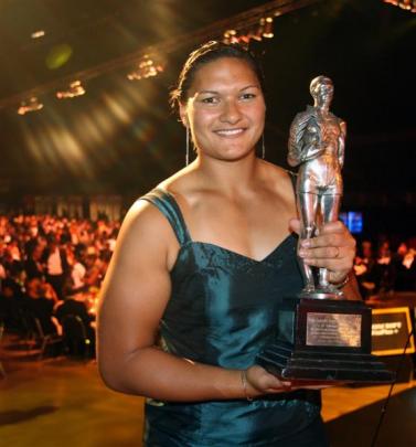 Shot putter Valerie Adams holds the trophy she received in 2008, the year she won gold at the...