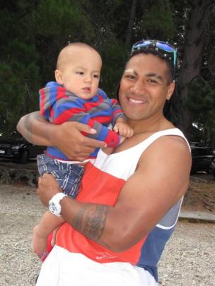 Highlanders player Ma'a Nonu with son Michael (12 months).