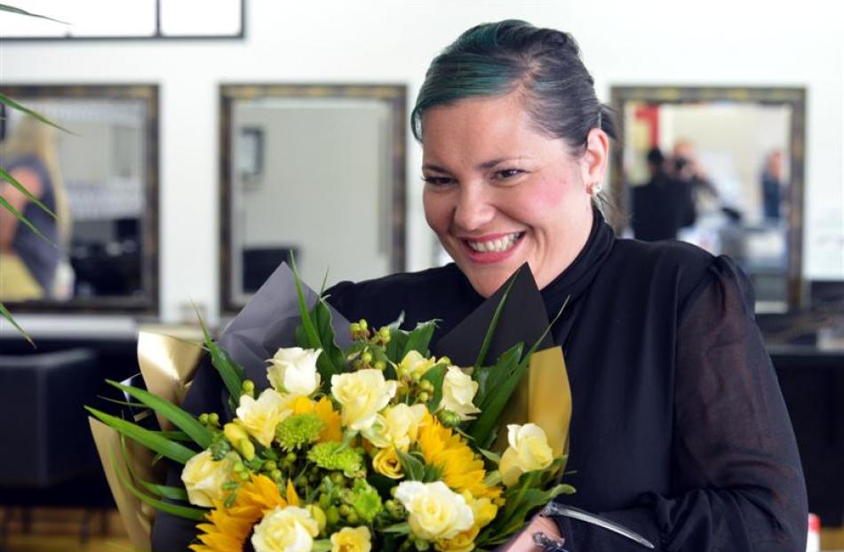 Configure Express Dunedin hairdresser Tania Stewart  gets flowers from her husband.