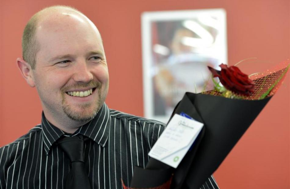 Work and Income staff member Hayden Mills with his Valentine's Day gift.