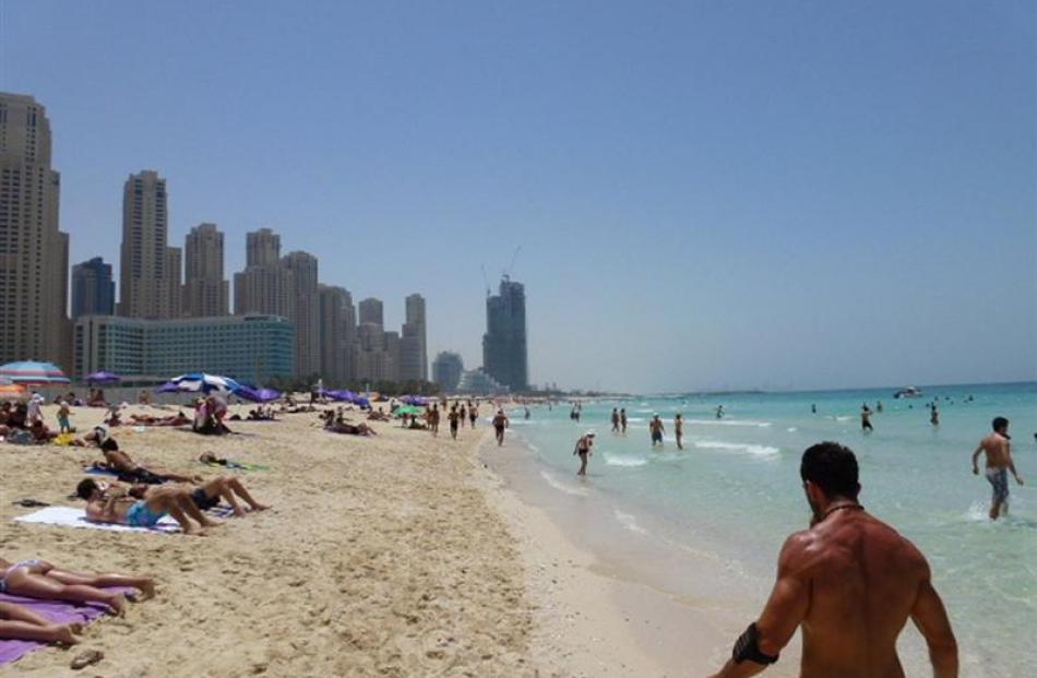 Sun-seekers populate Jemeirah Beach. Photo by Neville Peat.