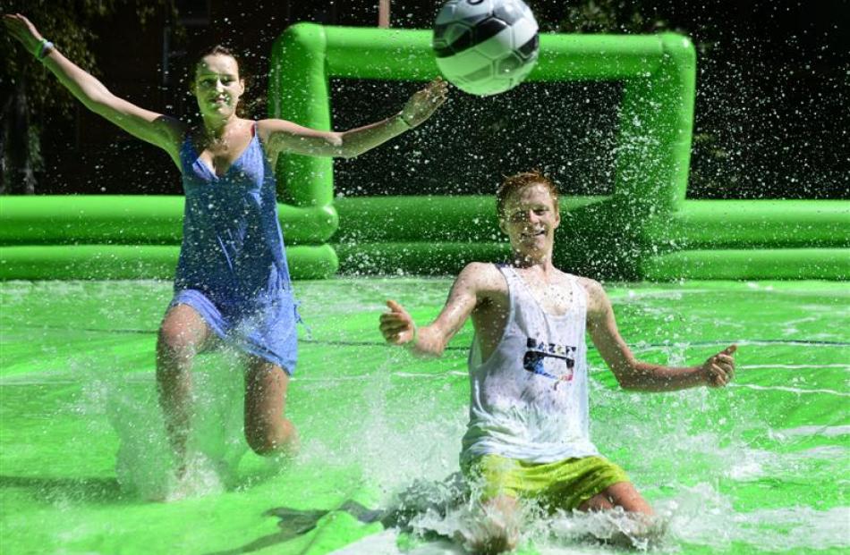Enjoying a splash at tent city on the museum lawn are Alex Blennerhassett (17), of Christchurch ...