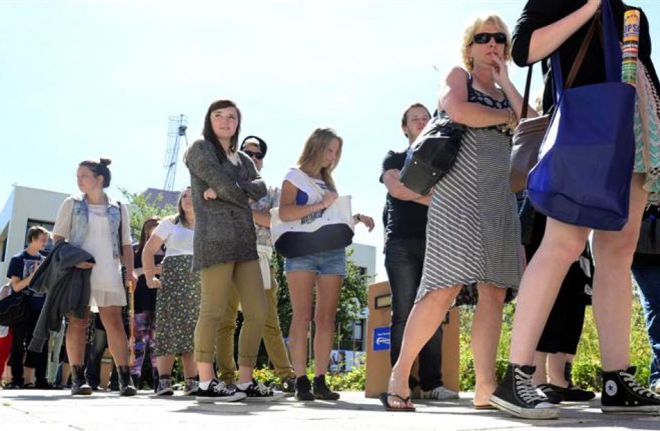 Students line up for  free food at a barbecue at Otago Polytechnic.  Photo by Peter McIntosh.