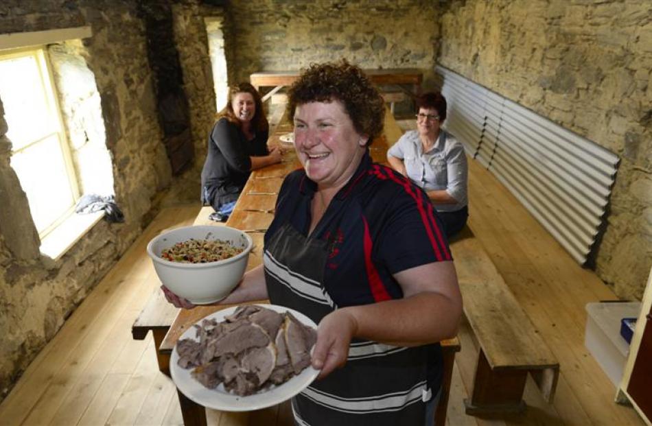 Michelle Holland (front), with Lynnore Templeton and Ellen Catherwood, in the cookshop at the dog...