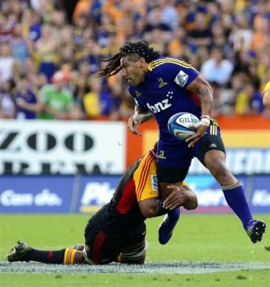 Ma'a Nonu is held by a Chiefs defender. Photo by Peter McIntosh