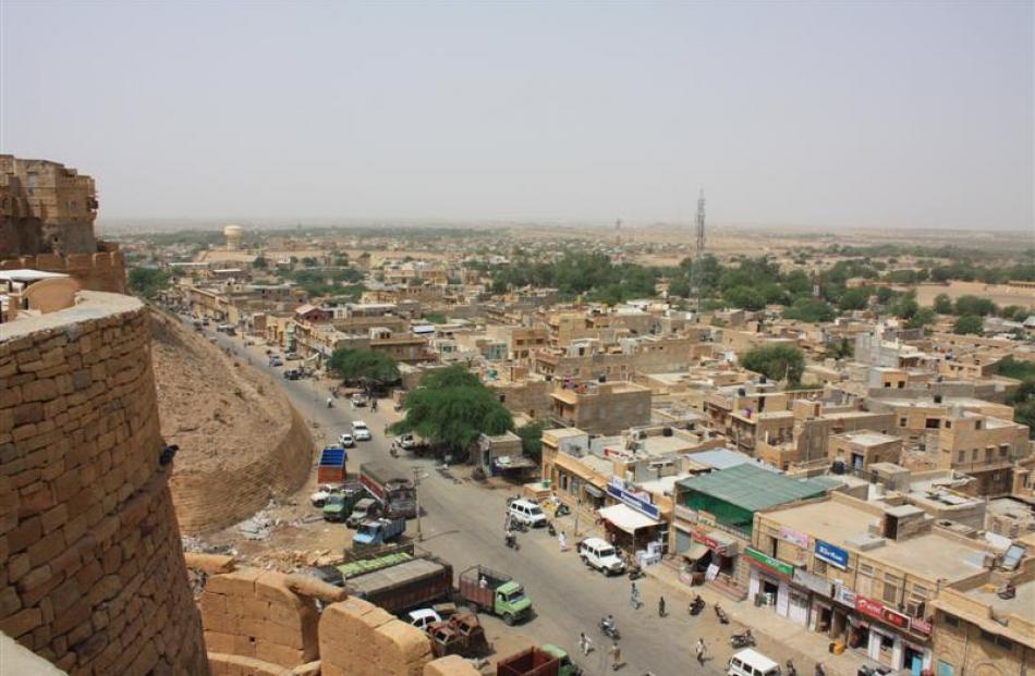 The desert town of Jaisalmer sprawls out below the Sonar Fort.