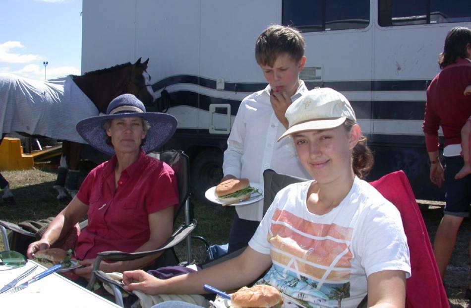 Amanda, Sebastian (10) and Beth Walker, of Ashburton, have lunch between horse competitions.