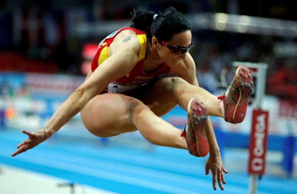 Patricia Sarrapio of Spain competes in the women's triple jump finals. REUTERS/Phil Noble