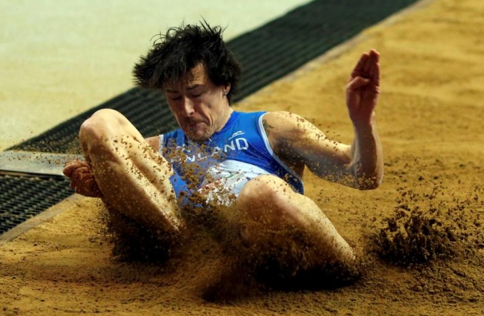 Tommi Evila of Finland competes during the men's long jump final. REUTERS/Phil Noble