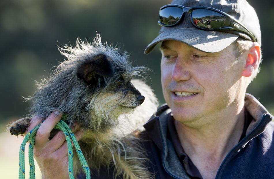 Celebrating a good run together at the agility competition are Fitz and owner Richard Powkey on...