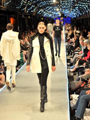 Leather sleeves and a black fur collar on  a classic winter coat from DEVa'L.