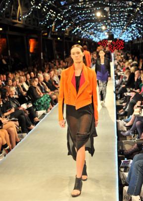 Company of Strangers combines loose sheer garments and  crop jackets.