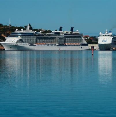 Celebrity Solstice and Pacific Pearl sit at berth in Port Chalmers yesterday  morning.