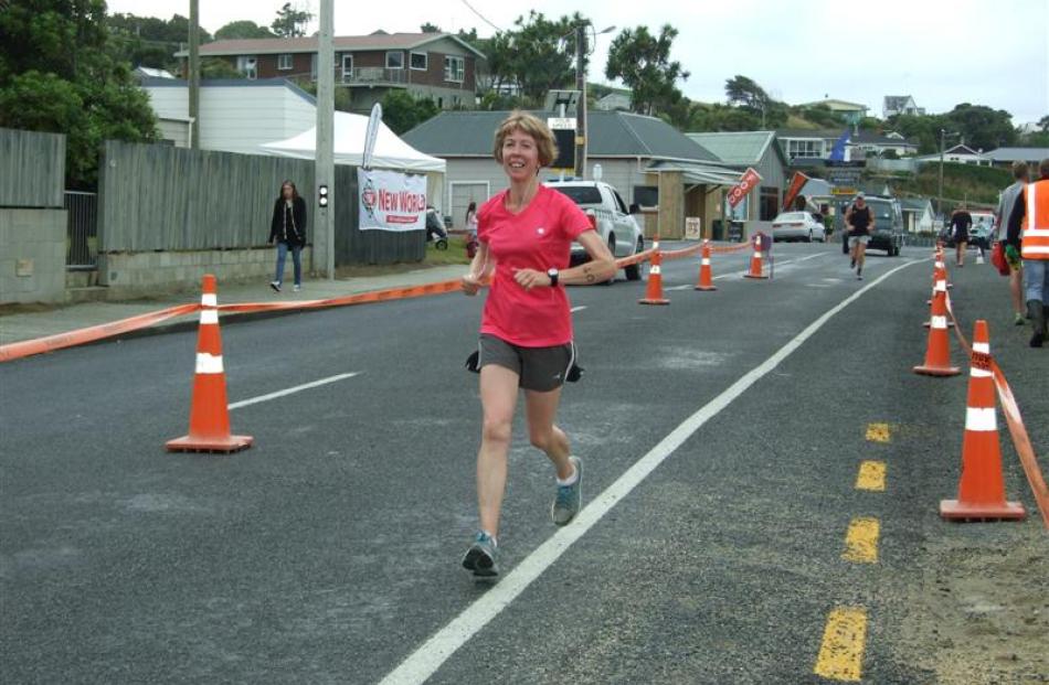 Ruth Johnstone, of Balclutha,  finishes the half-marathon at Kaka Point yesterday. Photo by...