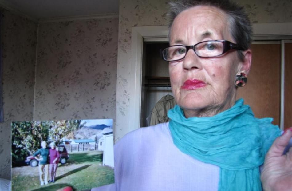 Car owner Marion Haig holds a photograph of her mother, Francie Haig, her mother's best friend...