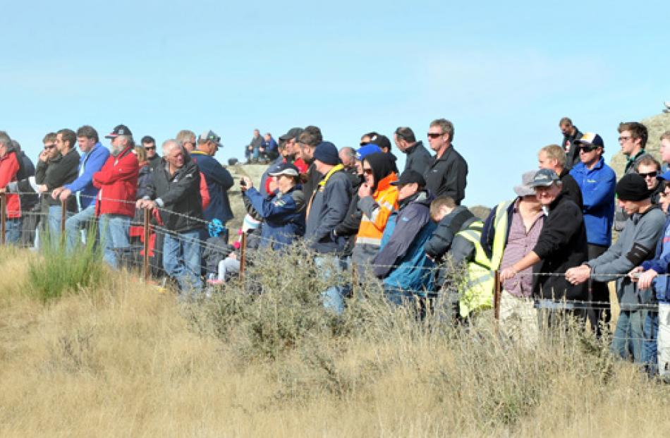 Spectators watch special stage 13 on Sunday.