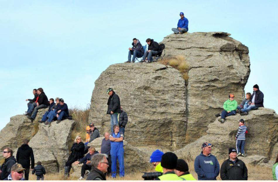 Spectators watch special stage 13 on Sunday.