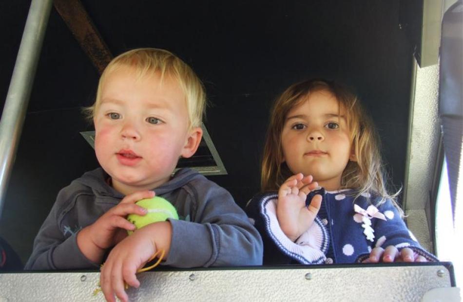 Dylan Hardy (2) and Luana Kirchoff (3) take a back seat in the fire engine at the family fun day.