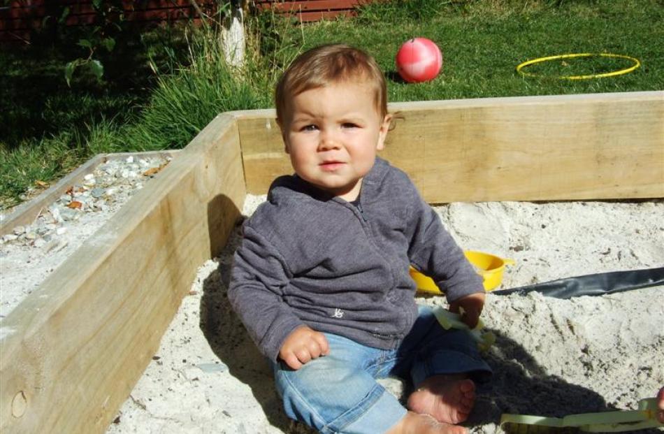 Ezra Worth (1) in the sandpit.