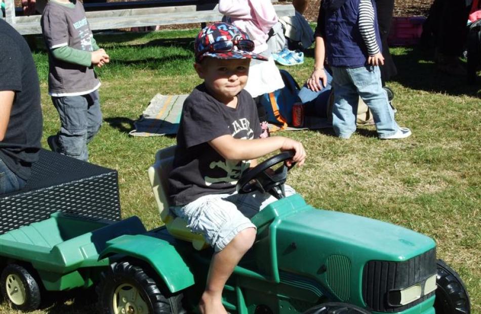 Phoenix Pecko (4) claims his tractor for the afternoon.