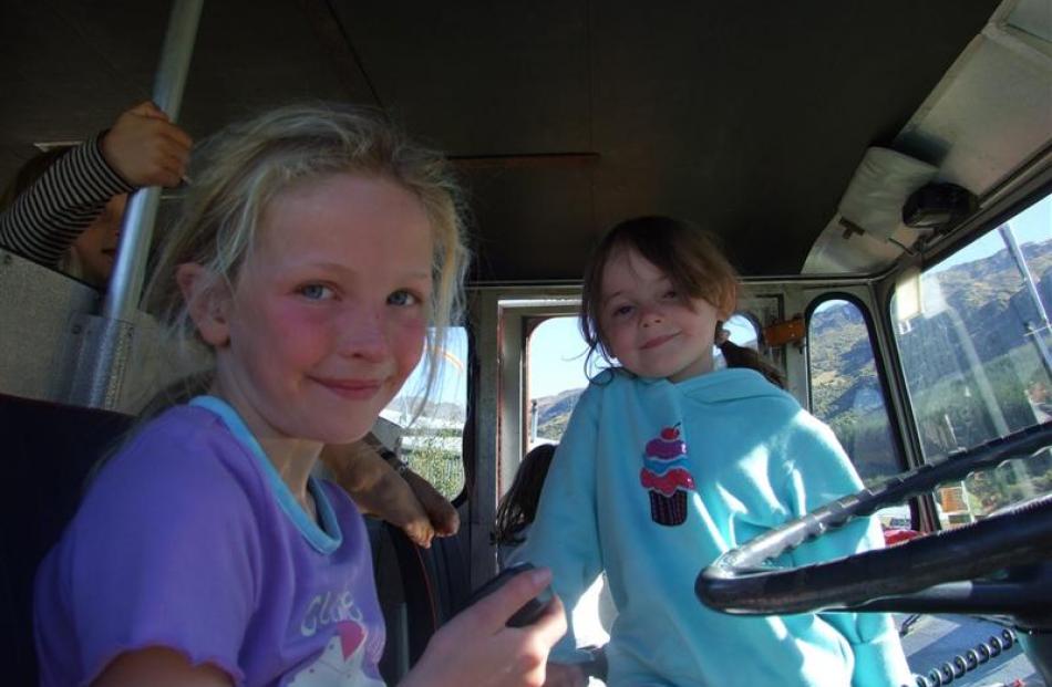 Taking the wheel of the fire engine was Zoe Waggett (8), watched over closely by Maddy Hutton.