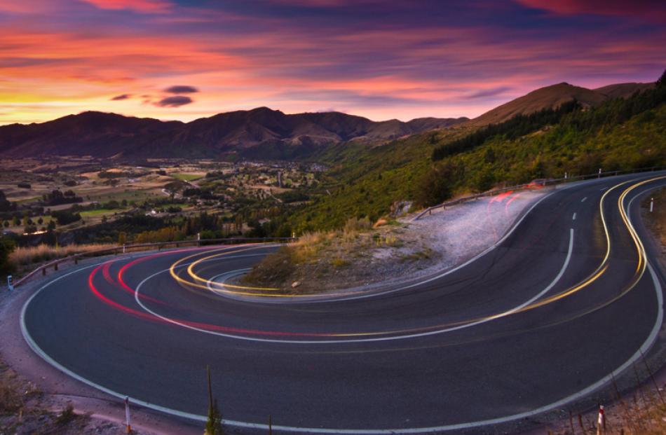 'Roads scour once pristine ranges of Central Otago' by Alaric McCarthy.