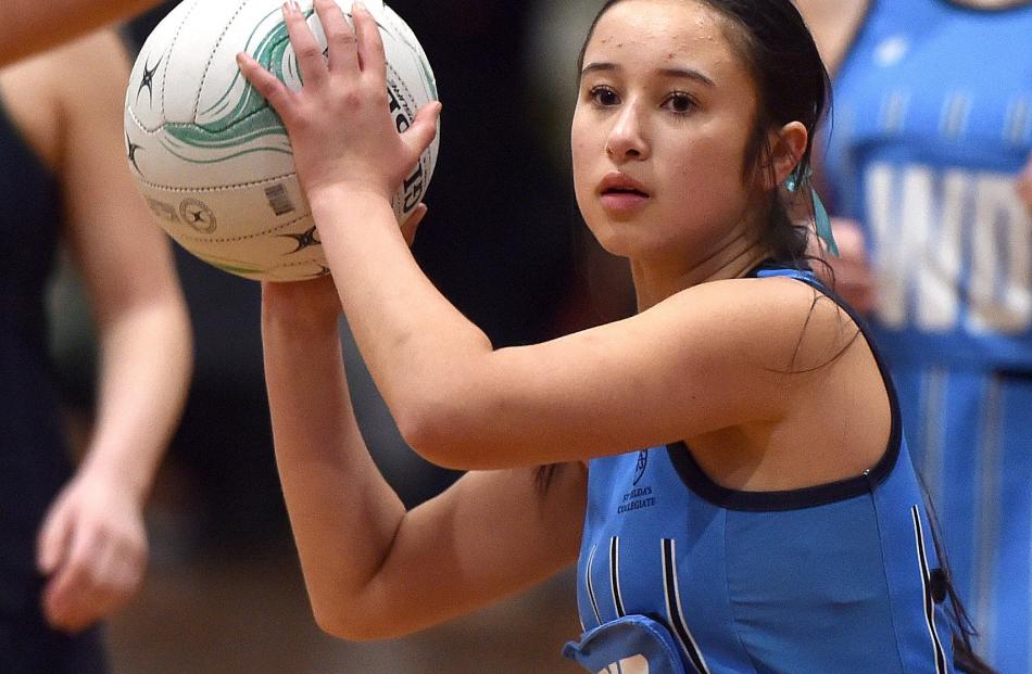 St Hilda’s Collegiate player Luana Ashton looks for support in the senior B final.