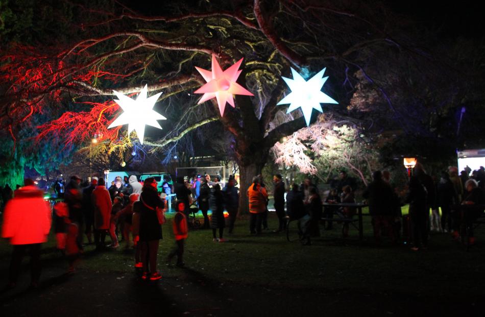People flocked to the bright and colourful lights of the Gore Gardens during Kahui Whetu on...