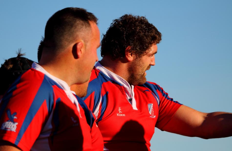 Jamie Mackintosh (Harbour) gives some scrummaging instructions to the referee as Ben Nolan and...